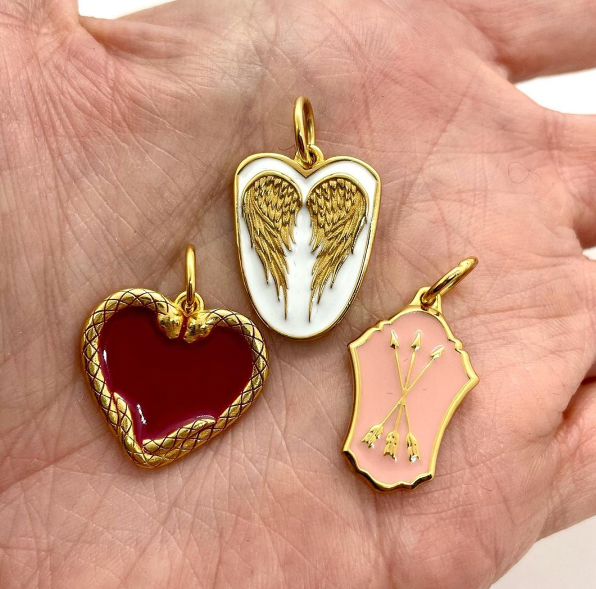 Heart with store wings charm